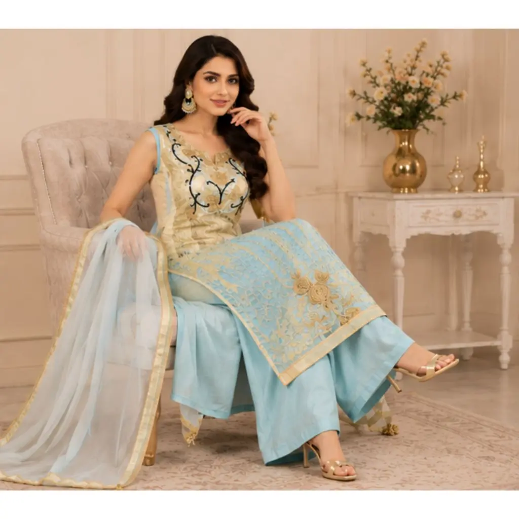 Step into elegance with this luxurious sky blue and gold embroidered palazzo suit set featuring intricate floral embroidery, a beautifully crafted kurta, matching palazzo pants, and a graceful org(2).webp