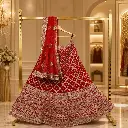Women's Red Bridal Lehenga Choli with Heavy Embroidery and Matching Net Dupatta