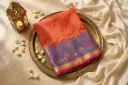 Coral Orange Silk Saree with Peacock Zari Border