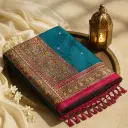 Teal Blue Silk Saree with Hand-Embroidered Elephant Border