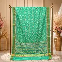 Turquoise Green Patola Saree with Pink Floral Accents and Geometric Border