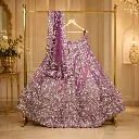 Mauve Bridal Lehenga Choli with Gold Embroidery and Matching Net Dupatta